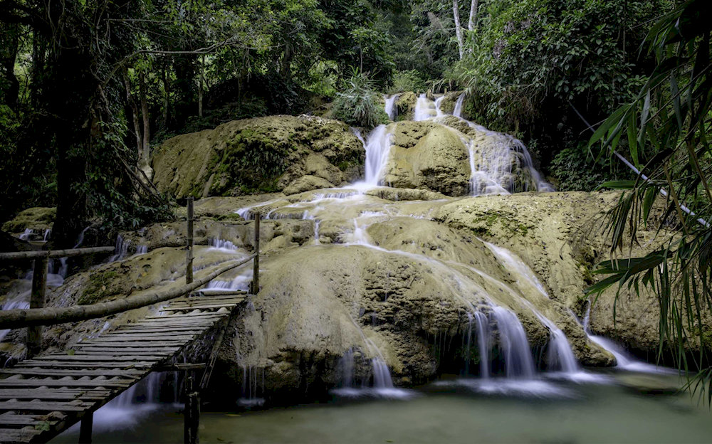 Crystal-clear waters at the 800-meter Hieu Waterfall in Pu Luong